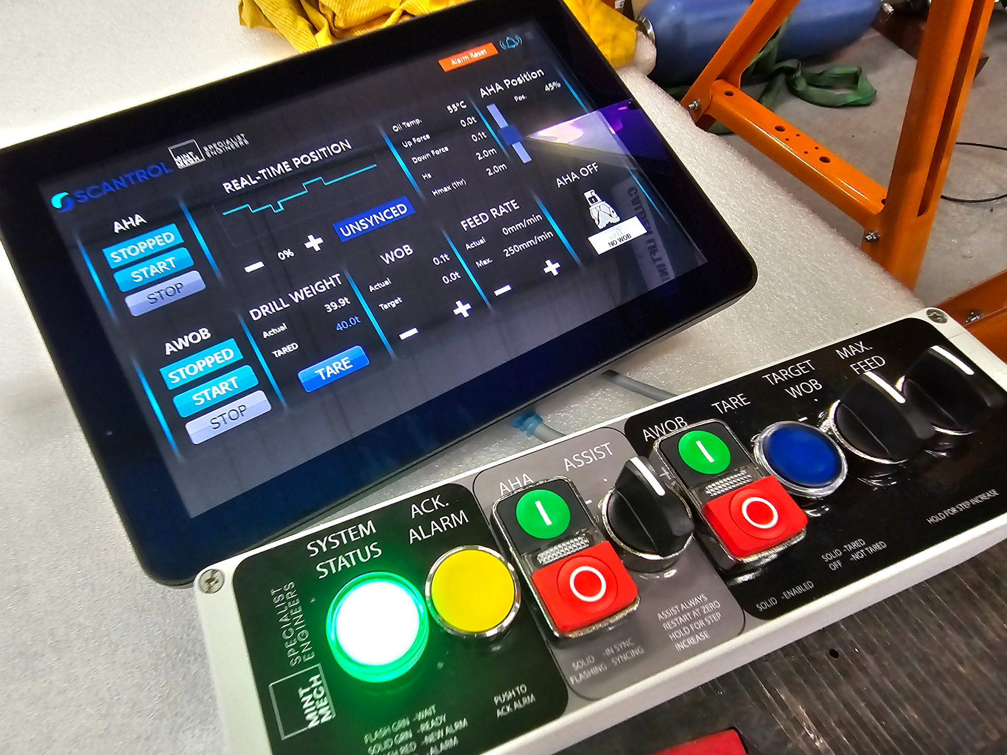 Touchscreen drilling control panel with status lamps and push buttons