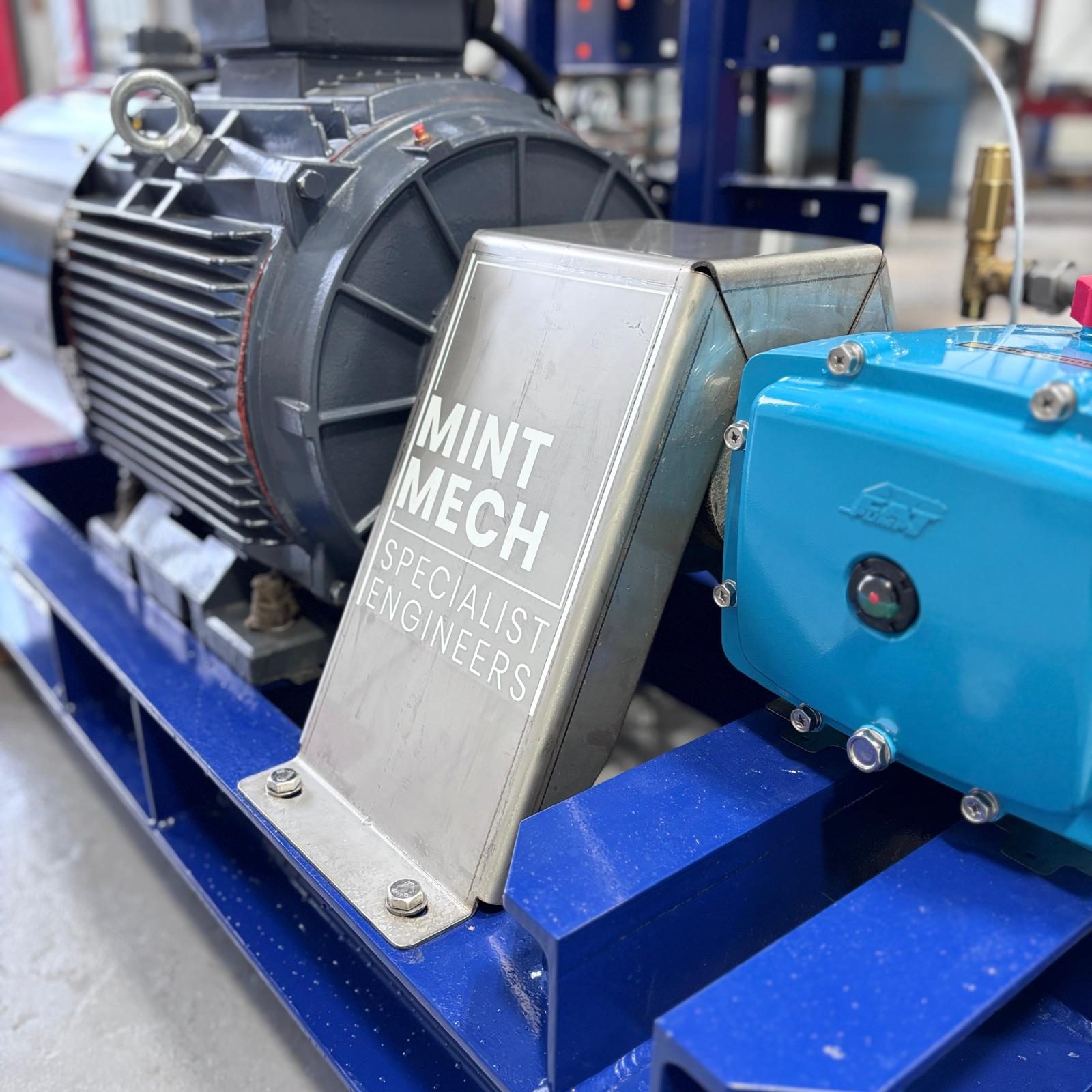 Electric motor and pump assembly with a MintMech Specialist Engineers guard plate